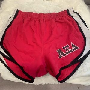 Alpha Xi Delta pink, black, and white shorts